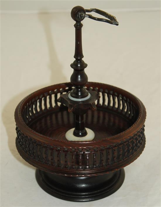 A Georgian style brass mounted turned and pierced lignum vitae cruet stand, H.9.5in.